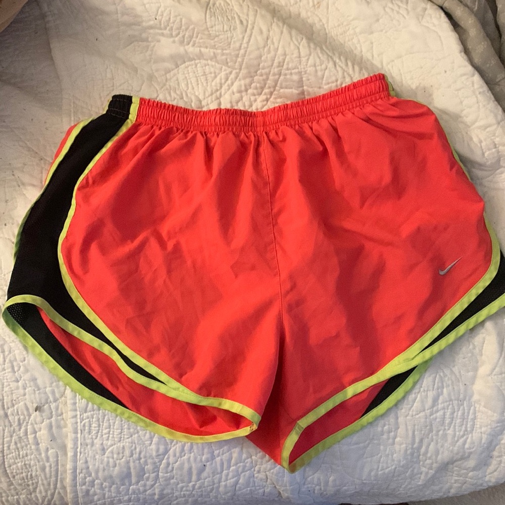 Nike dry-fit shorts, size medium. Pink with neon yellow and black sides